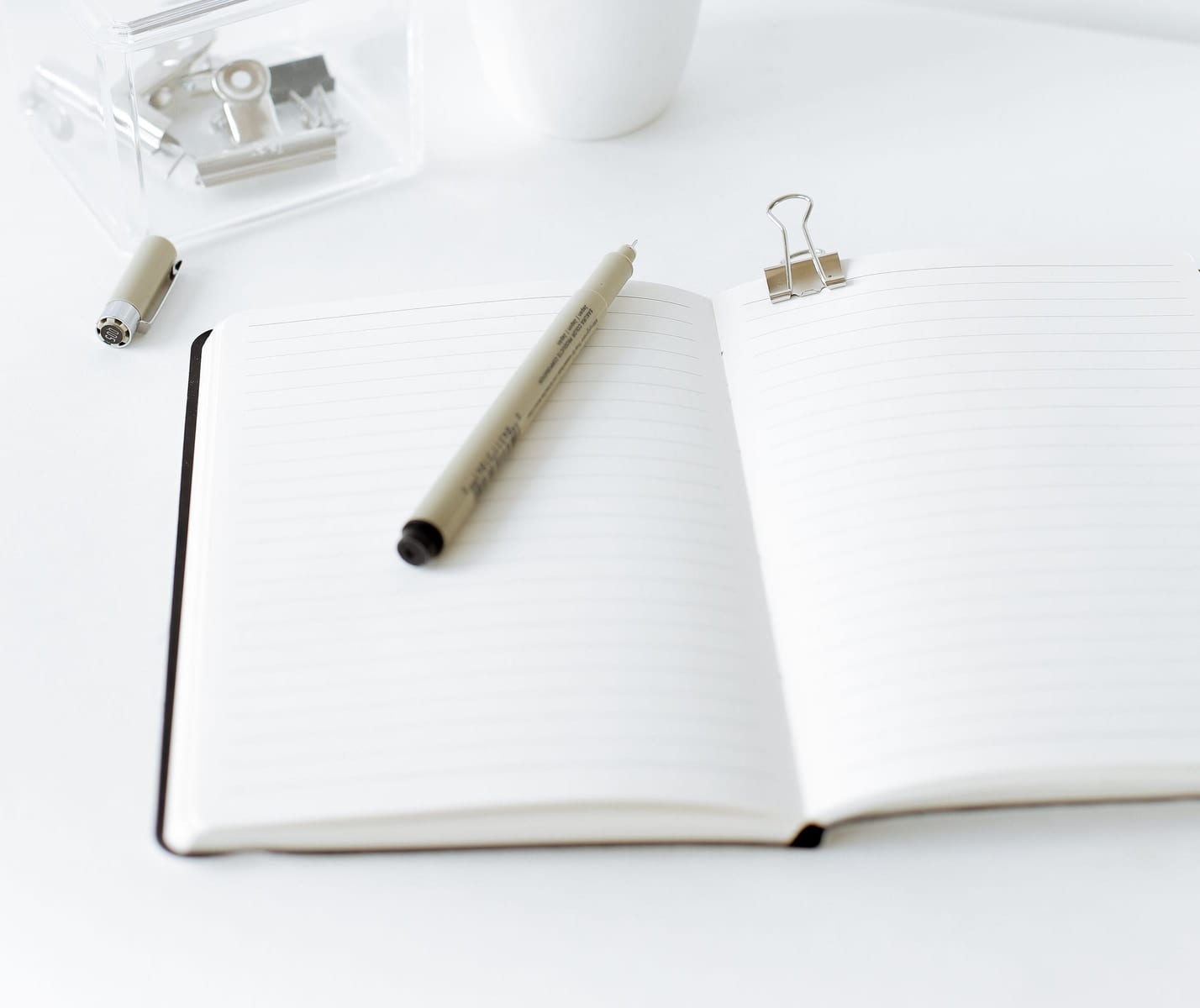 An open notebook and pen