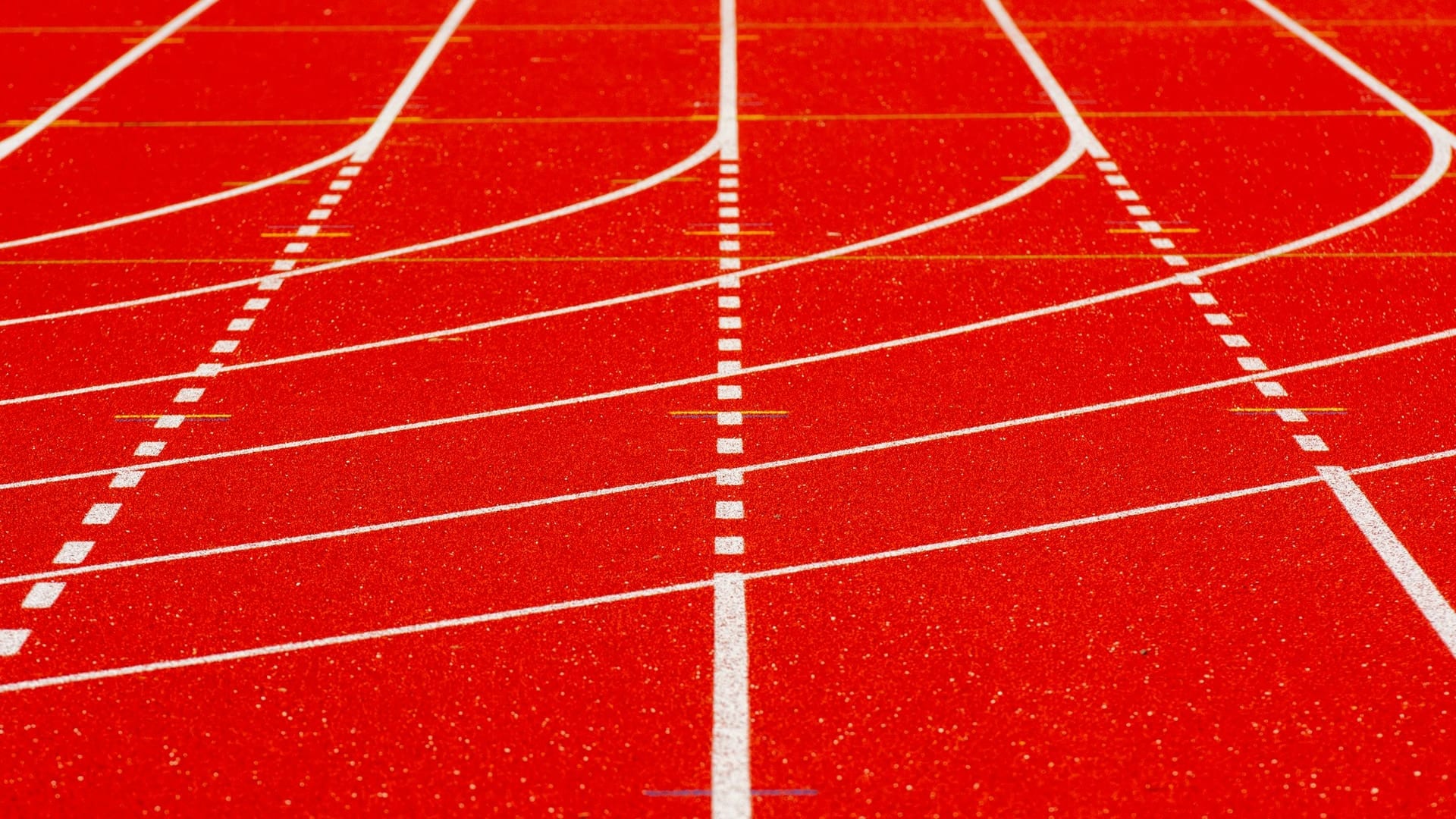 Red running-track lanes, close up